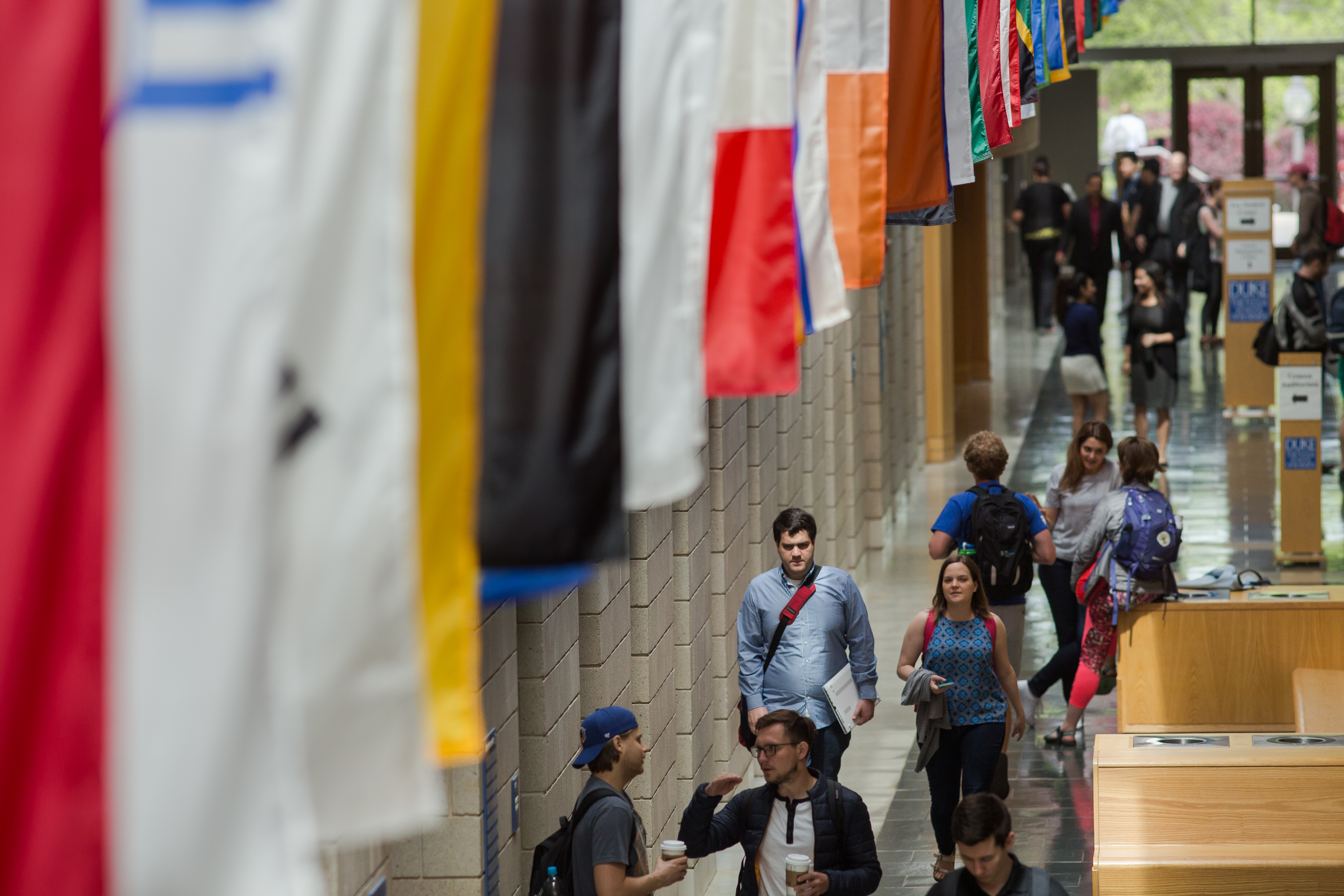 Students in Fuqua Mallway with flags